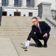 Above: Senate Minority Leader Harry Reid (D-NV) cleans the Capitol steps up after Buster.